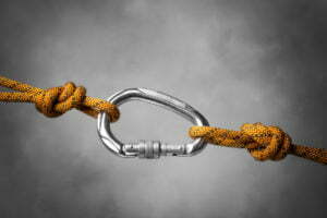 Image of a carabiner hook with a climbing rope