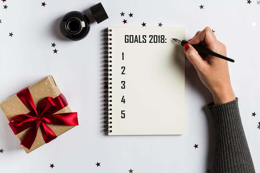 woman writing her goals