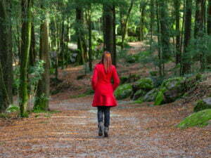 woman walking in the woods