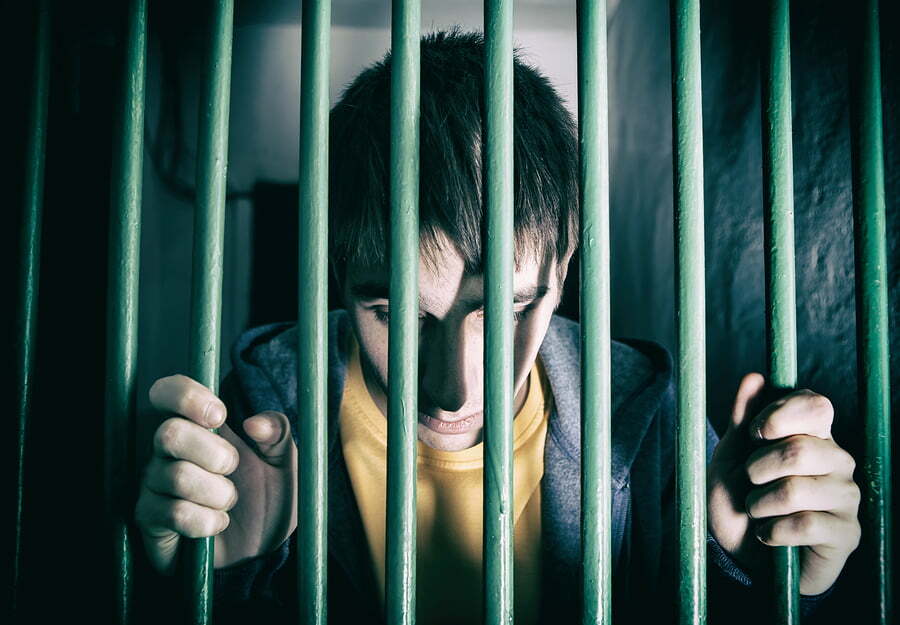 young man in jail